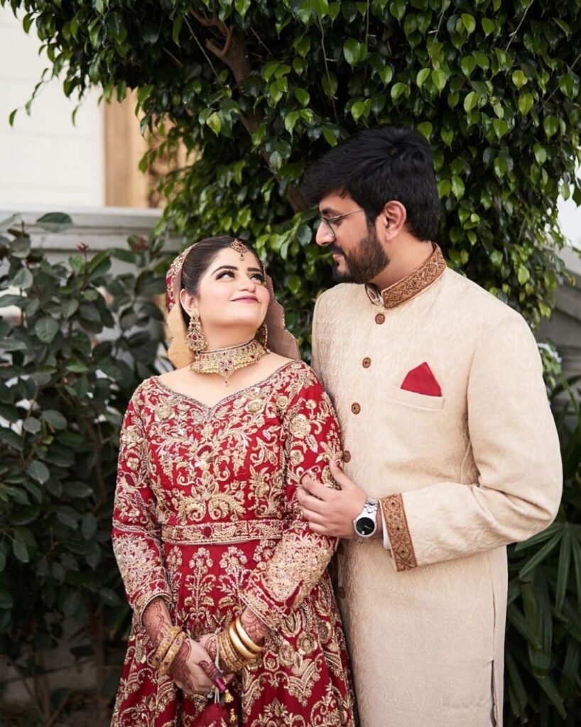 Crimson Red Bridal Lehenga and Champagne Gold Sherwani Couple Set